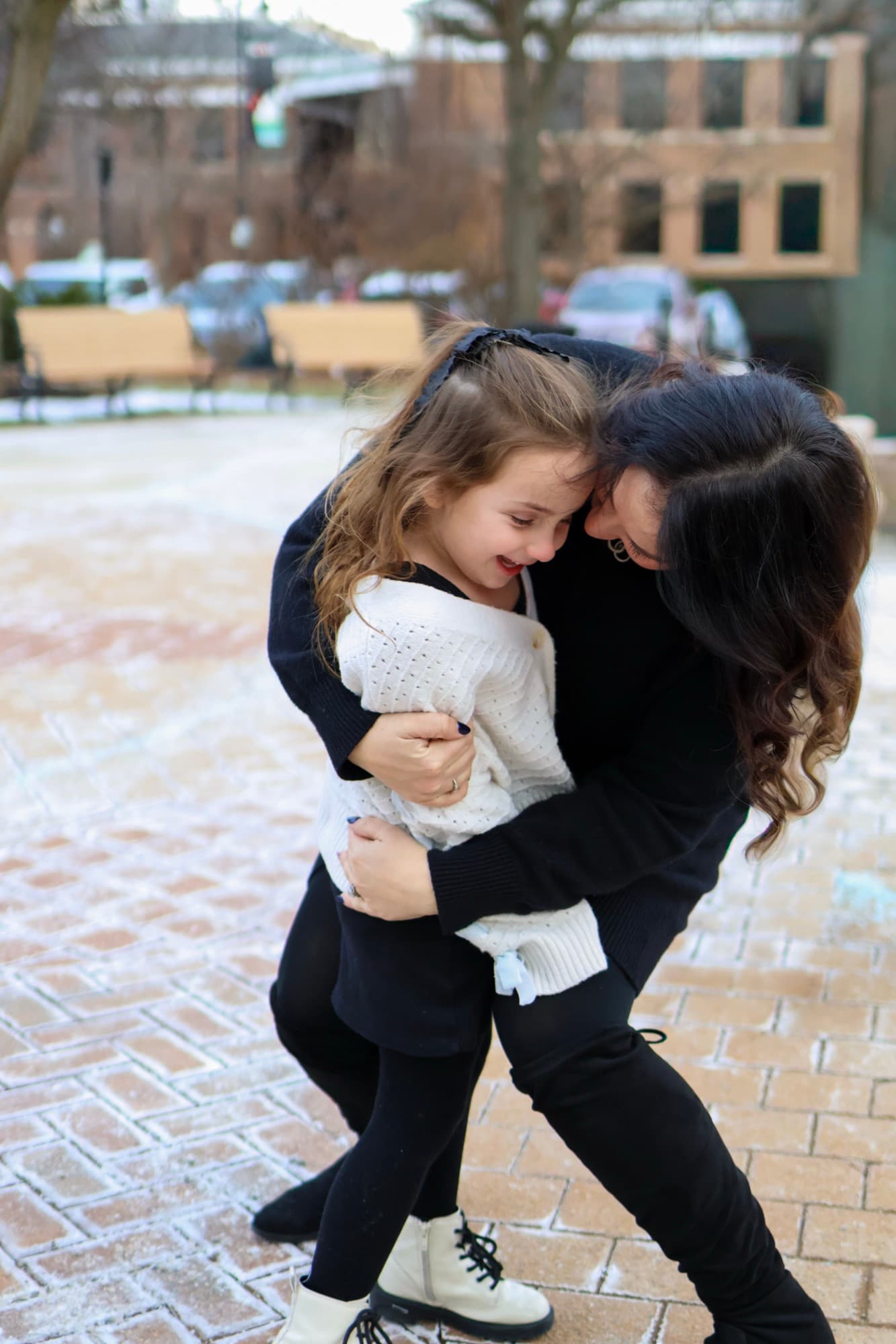 Mother and daughter hugging outside Skokie Library — mom and daughter portrait