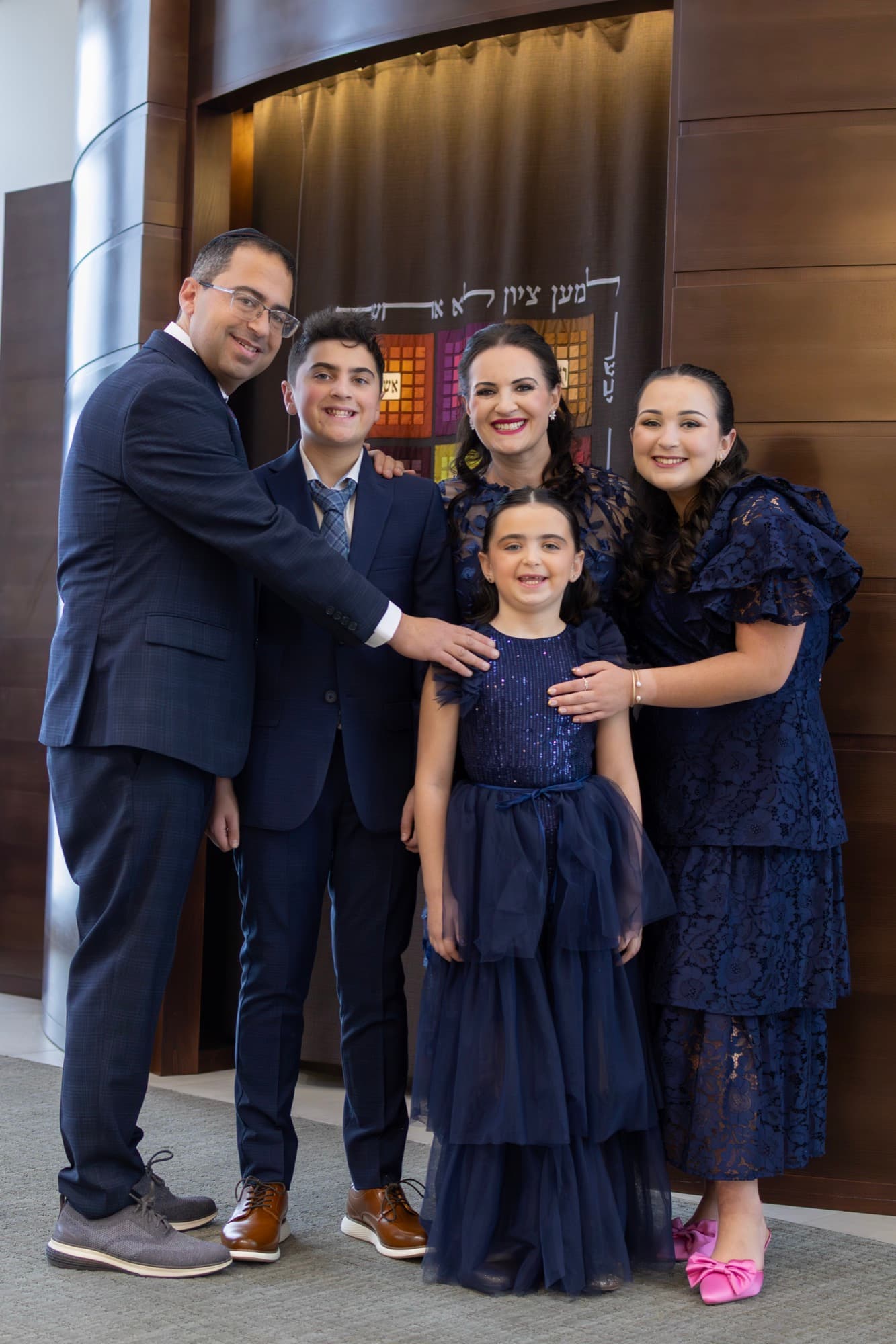 Family portrait in front of the Torah ark — Bar Mitzvah family photography