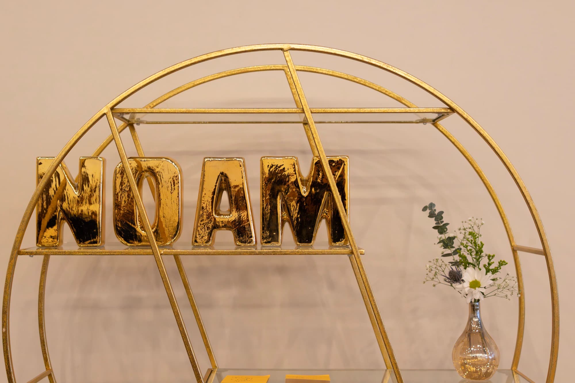 Gold name letters on display shelf — Bar Mitzvah décor detail